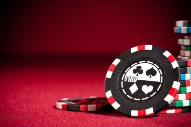 Close-up of dealer managing Sic Bo dice and chip placement at a professional gaming table